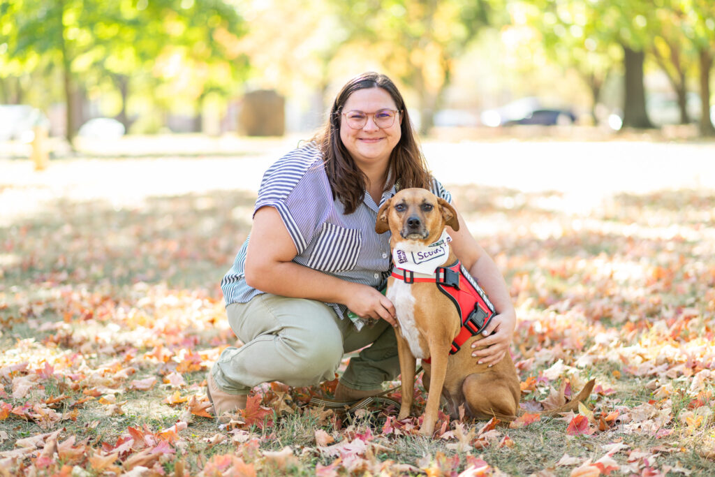 Woman outside with a therapy dog