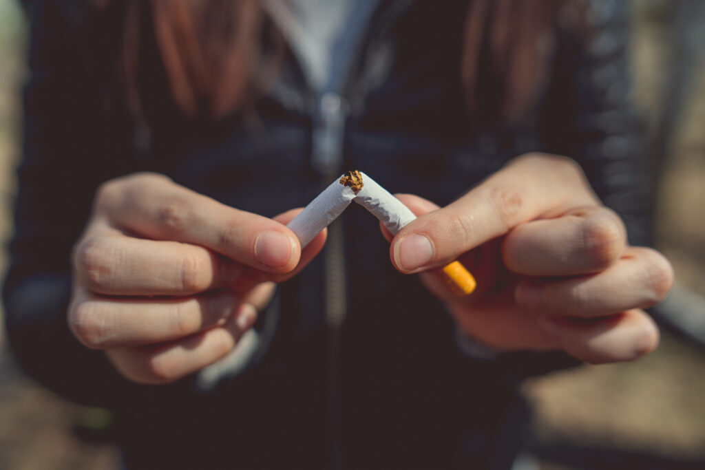 Ripping a cigarette in half